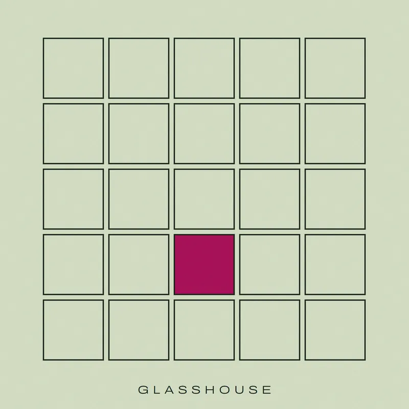 A five-by-five grid of empty square panes in dark green line on pale green, one pane filled magenta. GLASSHOUSE spaced out along the bottom.